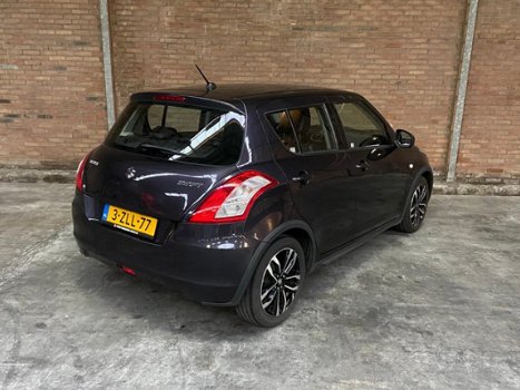 Suzuki Swift - 5-DEURS 1.2 Style, NAVI, CAMERA, HALFLEDER, CRUISE - 1