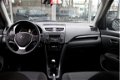 Suzuki Swift - 1.2 EXCLUSIVE * SCHUIFDAK/ KEYLESS/ ECC/ 16 INCH - 1 - Thumbnail