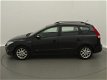 Hyundai i30 CW - 1.6i i-Motion / airco / lmv / zwart-metallic - 1 - Thumbnail