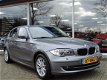 BMW 1-serie - 118i Business Line Ultimate Edition Automaat - Schuifdak | PDC | Climat/Cruise | Afn. - 1 - Thumbnail