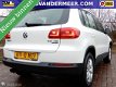 Volkswagen Tiguan - 2.0 TSI Sport&Style 4Motion AUTOMAAT/XENON/PANORAMADAK/CAMERA/NAVI/ELEK.TREKHAAK - 1 - Thumbnail