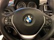 BMW 1-serie - 116i Centennial Executive NAVI TREKHAAK EERSTE EIGENAAR OPENDAK CLIMATE LM VELGEN CRUI - 1 - Thumbnail