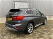 BMW X1 - 1.6d sDrive Centennial High Executive Sport 2016 / Leer / Xenon / Head-up / Keyless / Came - 1 - Thumbnail