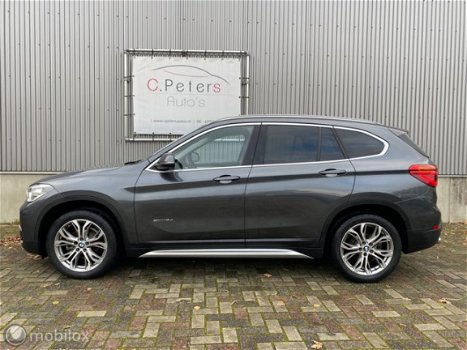 BMW X1 - 1.6d sDrive Centennial High Executive Sport 2016 / Leer / Xenon / Head-up / Keyless / Came - 1