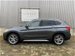 BMW X1 - 1.6d sDrive Centennial High Executive Sport 2016 / Leer / Xenon / Head-up / Keyless / Came - 1 - Thumbnail