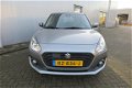 Suzuki Swift - 1.2 DualJet 90pk Smart Hybrid Stijl Trekhaak PDC - 1 - Thumbnail