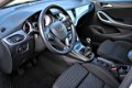 Opel Astra Sports Tourer - 1.0 Turbo Online Edition ✅NAP| Navi 900| PDC v+a| Camera| Orig.NL| Airco| - 1 - Thumbnail