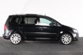 Volkswagen Touran - 1.4 TSI Highline 7 persoons | pano dak | xenon | navi + camera | standkachel | - 1 - Thumbnail