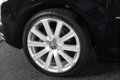 Volkswagen Touran - 1.4 TSI Highline 7 persoons | pano dak | xenon | navi + camera | standkachel | - 1 - Thumbnail