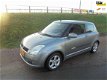 Suzuki Swift - 1.5 Exclusive swift 1.5 benzine airco lmv trekhaak - 1 - Thumbnail