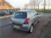 Suzuki Swift - 1.5 Exclusive swift 1.5 benzine airco lmv trekhaak - 1 - Thumbnail