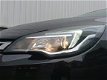 Opel Astra - 1.0 Turbo 120 Jaar Edition 105PK | AGR-Stoelen | Climate Control | Navi | Sensoren Voor - 1 - Thumbnail