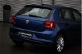 Volkswagen Polo - Comfortline 1.0 TSI 95pk Navigatie DAB Parkeersensoren Cruise control Climatronic - 1 - Thumbnail