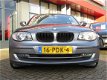 BMW 1-serie - 118i Business Line 143 PK | CLIMA-AIRCO | 6-BAK | LM VELGEN | INCL. BOVAG GARANTIE - 1 - Thumbnail