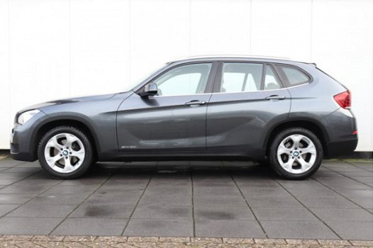 BMW X1 - sDrive20i Chrome Line | 184 PK | AUTOMAAT | NAVI | CRUISE | CLIMATE | LMV | XENON | DEALER - 1