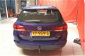 Opel Astra Sports Tourer - 1.4 Business+ 150pk 1400KG GEREMD - 1 - Thumbnail