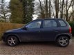 Opel Corsa - 1.2iE GLS | Stuurbekrachtiging - 1 - Thumbnail