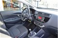 Kia Rio - 1.2 CVVT ComfortLine | Cruise control | Bluetooth | Airco | 5 Drs | Eerste eigenaar | Fabr - 1 - Thumbnail