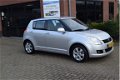 Suzuki Swift - 1.3 Comfort | 5drs | AIRCO | LMV | CV | - 1 - Thumbnail