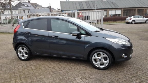 Ford Fiesta - 1.25 Titanium X-Pack 82 Pk - 5 Deurs - Airco ecc - Cruise - L.m velgen - Pdc - 1