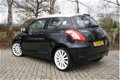 Suzuki Swift - 1.2 Black & White | Airco | LMV | El. ramen | Multi stuurwiel - 1 - Thumbnail