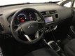 Kia Rio - 1.2 CVVT Plus Pack 2014 Airco Navi *84DKM*Wit*NL-Auto - 1 - Thumbnail