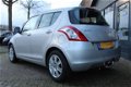 Suzuki Swift - 1.2 94PK 5Drs, Airco, CruiseCtrl, Trekhaak - 1 - Thumbnail