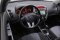 Kia Cee'd - 1.4 CVVT Seven NL-Auto Airco Navigatie Cruise Control Trekhaak - 1 - Thumbnail