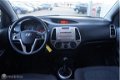 Hyundai i20 - 1.2i DynamicVersion Airco / 5 deurs - 1 - Thumbnail