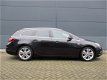 Opel Astra Sports Tourer - Xenon/OPC Line/140pk/Leder/Navi/Trekhaak/1.4 Turbo Sport - 1 - Thumbnail