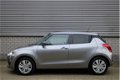 Suzuki Swift - 1.2 Select | Airco | Achteruitrijcamera | Navigatie - 1 - Thumbnail