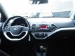 Kia Picanto - 1.2 CVVT 85 PK AUT Comfort Pack lage km stand - 1 - Thumbnail