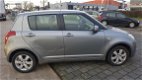 Suzuki Swift - 1.3 Comfort - 1 - Thumbnail