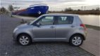 Suzuki Swift - 1.3 Comfort - 1 - Thumbnail