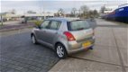 Suzuki Swift - 1.3 Comfort - 1 - Thumbnail