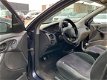 Ford Focus Wagon - 1.6i 16V Ambiente - 1 - Thumbnail