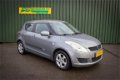 Suzuki Swift - 1.2 Comfort 5-drs + Airco / Velgen / 1e eigenaar / Garantie - 1 - Thumbnail