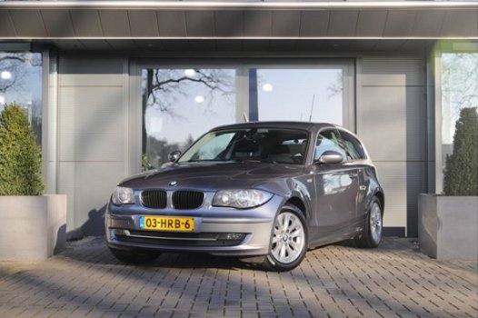 BMW 1-serie - 118i Business Line | Navigatie | Airco | Cruise Control | Licht- en regensensor - 1