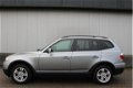 BMW X3 - 2.0d High Executive Panoramadak Airco Navigatie Automaat Leder Dvd Speler - 1 - Thumbnail