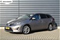 Toyota Auris Touring Sports - 1.8 Hybrid Executive | Camera | Panoramadak | Navigatie - 1 - Thumbnail