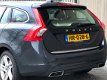 Volvo V60 - 2.4 D6 Twin Engine R-Design 2015 Grijs - 1 - Thumbnail