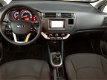 Kia Rio - 1.2 CVVT Plus Pack *Navi, Bluetooth, Airco - 1 - Thumbnail