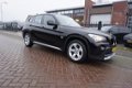 BMW X1 - SDRIVE 1.8D 143PK EXECUTIVE PERF.STAAT NAVI STOELVERWARMING CLIMA BLUETOOTH 17INCH PARKEER - 1 - Thumbnail