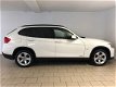 BMW X1 - 1.8i sDrive Executive AIRCO CLIMA NAVI BLUETOOTH VELGEN PDC REGENSENSOR PRIVACY GLAS NIEUW - 1 - Thumbnail