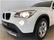 BMW X1 - 1.8i sDrive Executive AIRCO CLIMA NAVI BLUETOOTH VELGEN PDC REGENSENSOR PRIVACY GLAS NIEUW - 1 - Thumbnail