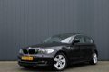 BMW 1-serie - 118i EffDyn. Ed. Business Line Ultimate Edition / NAVI / LEDER / SPORTSTOELEN - 1 - Thumbnail