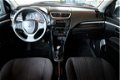 Suzuki Swift - 1.2 Comfort EASSS / KEYLESS ENTRY / CRUISE / STOELVERW. / - 1 - Thumbnail