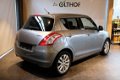 Suzuki Swift - 1.2 Comfort EASSS / KEYLESS ENTRY / CRUISE / STOELVERW. / - 1 - Thumbnail