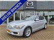 BMW 1-serie - 116i EDE EXECUTIVE | NAVIGATIE | BI-XENON VERLICHTING | HALF LEDEREN BEKLEDING | RIJKL - 1 - Thumbnail