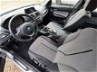 BMW 1-serie - 116i EDE EXECUTIVE | NAVIGATIE | BI-XENON VERLICHTING | HALF LEDEREN BEKLEDING | RIJKL - 1 - Thumbnail